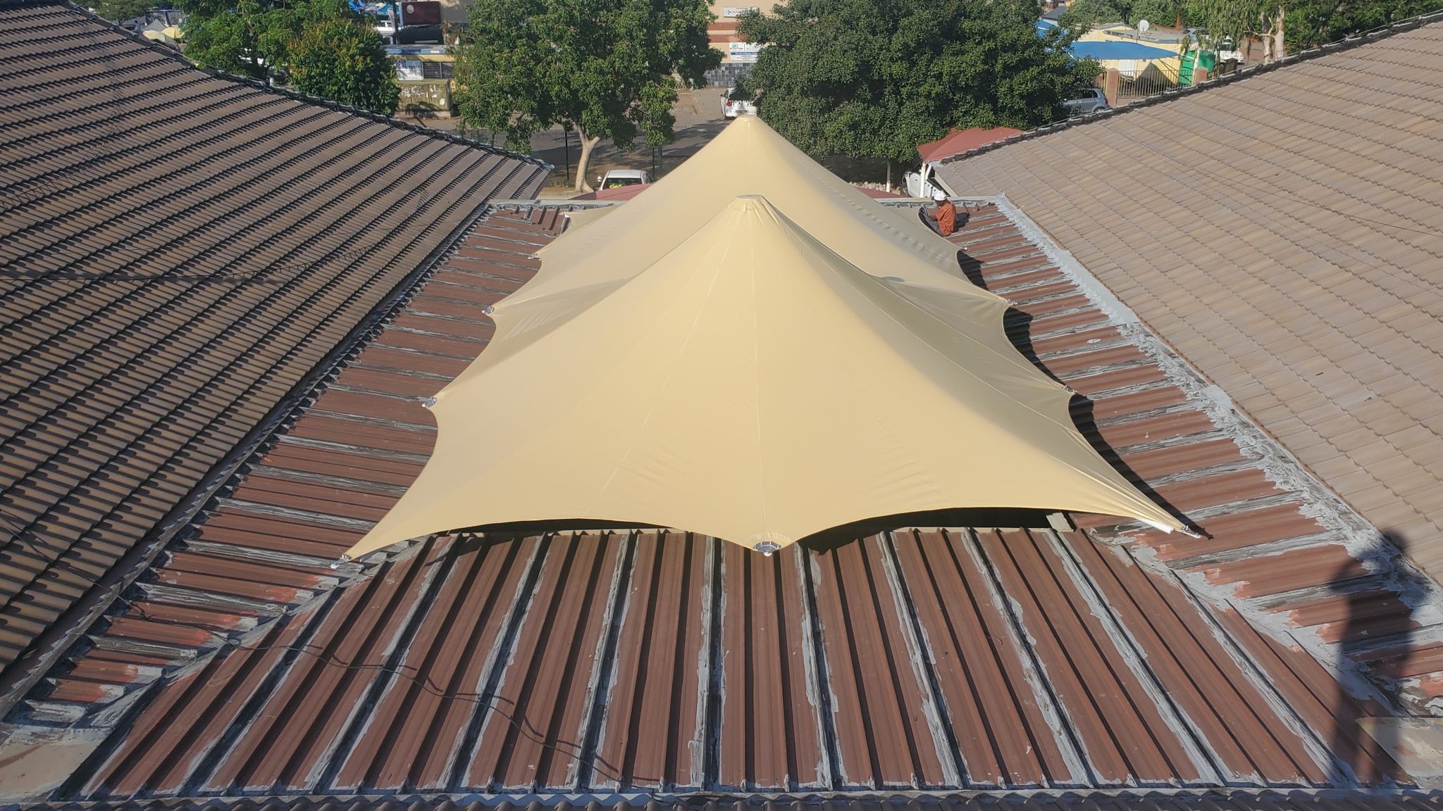 Double tensile umbrella courtyard cover installed by RAK Structures for Botswana Hospital
