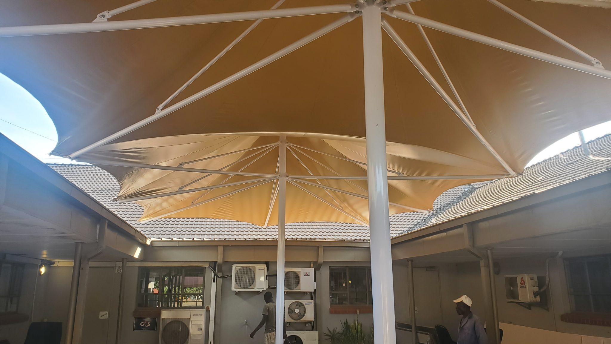 Double tensile umbrella courtyard cover installed by RAK Structures for Botswana Hospital