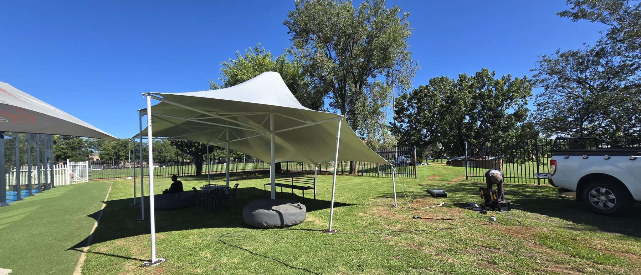 Custom tensile shade cover installed by RAK Structures for Virgin Active Padel courts in Bedfordview