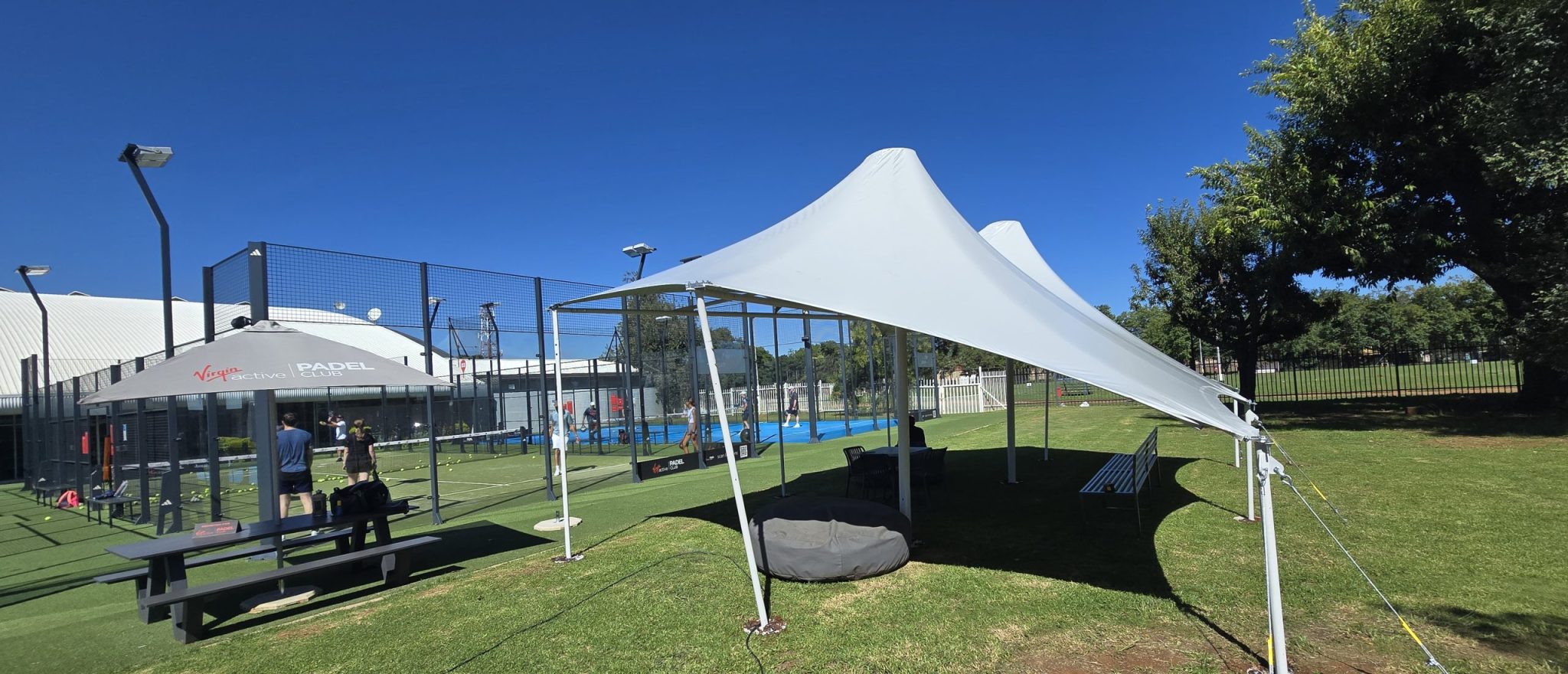 Custom tensile shade cover installed by RAK Structures for Virgin Active Padel courts in Bedfordview