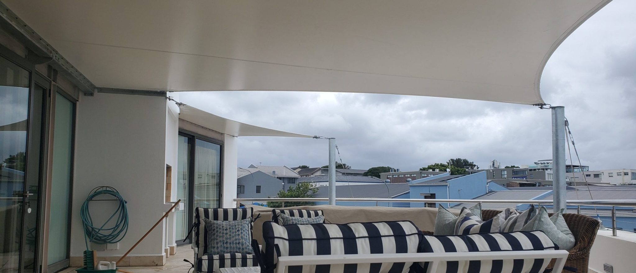 Custom shade sail patio cover by RAK Structures installed at a private residence
