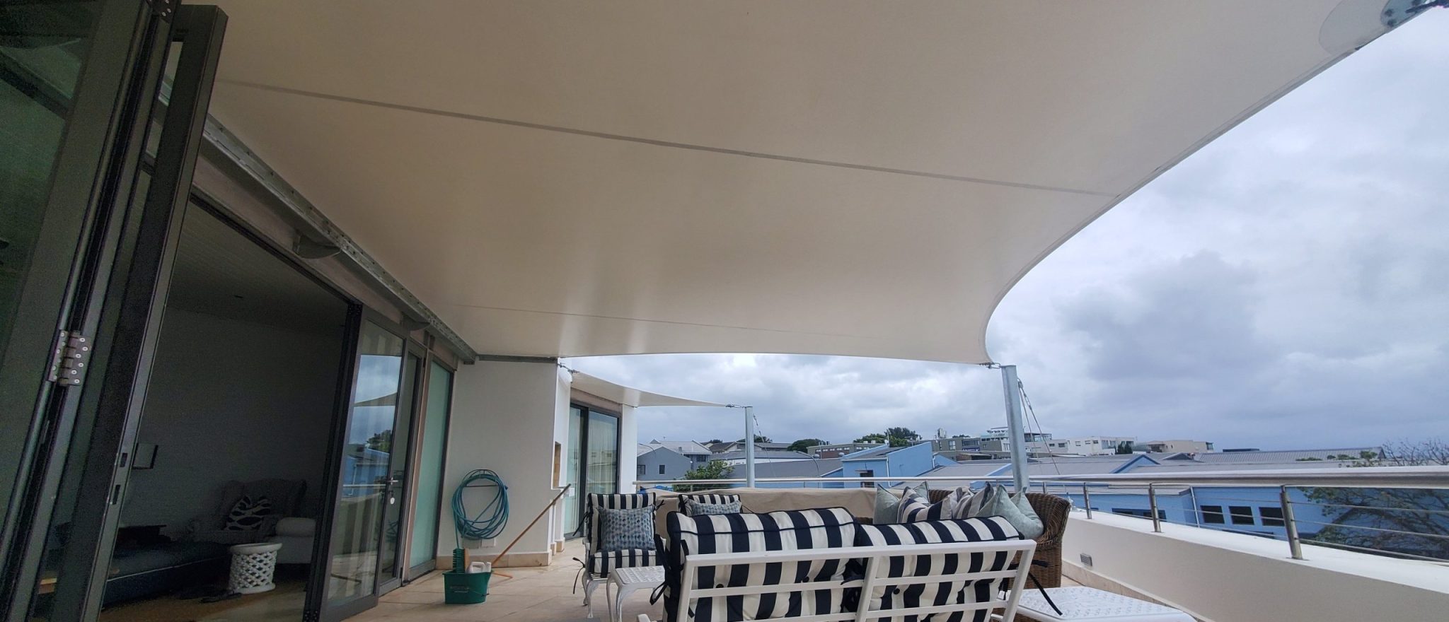 Custom shade sail patio cover by RAK Structures installed at a private residence