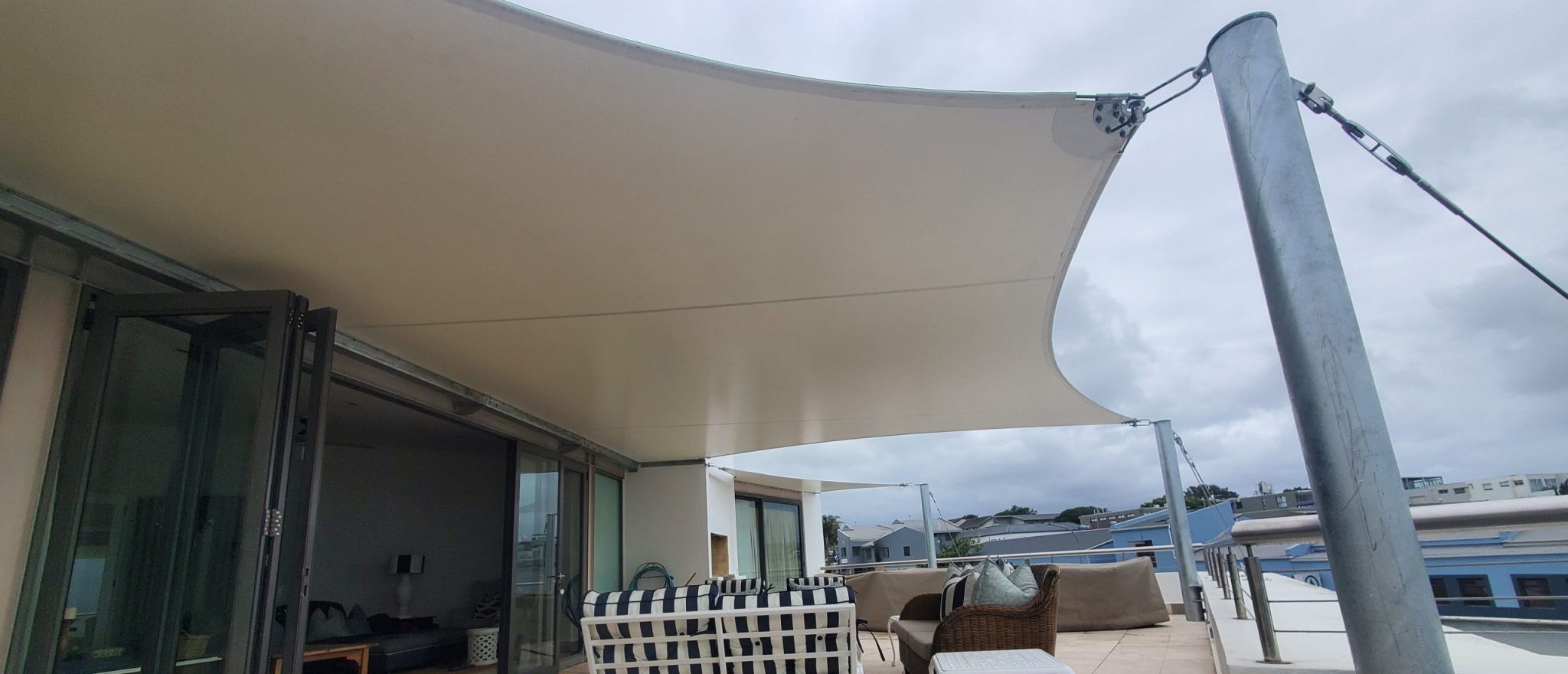 Custom shade sail patio cover by RAK Structures installed at a private residence