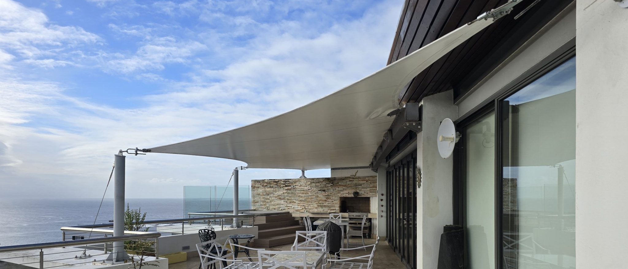 Custom shade sail patio cover by RAK Structures installed at a private residence