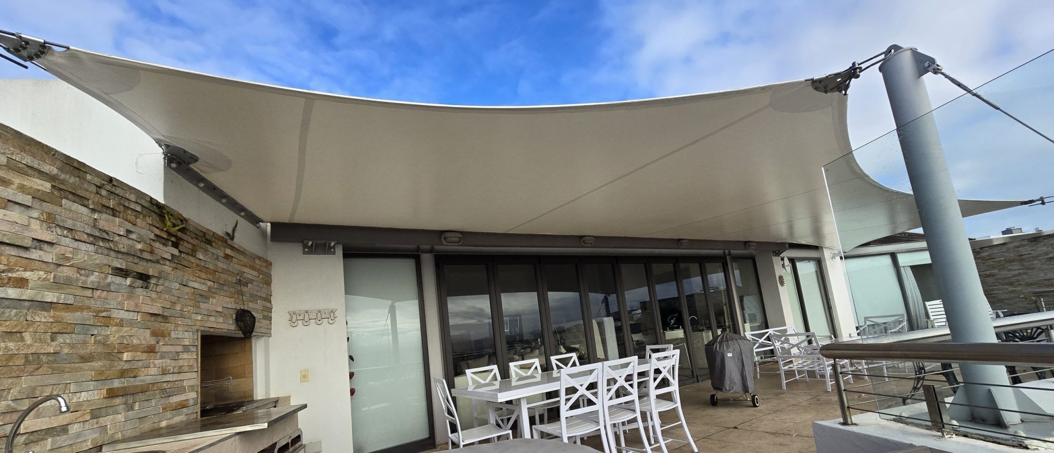 Custom shade sail patio cover by RAK Structures installed at a private residence
